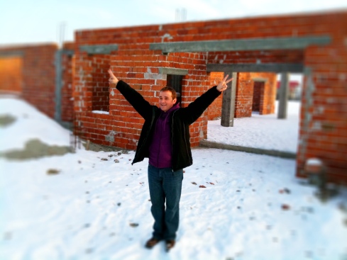 Ovidiu in front of the House of Joy. Construction will start again in the spring.
